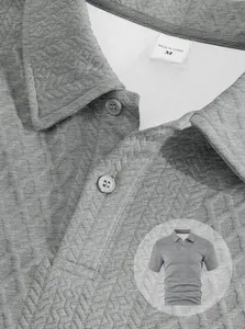 Detailed macro view of men's short sleeve polo shirt showing grey texture jacquard fabric
