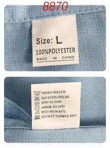 Detail view of the wash label and 100% polyester material of the blue men's shirt