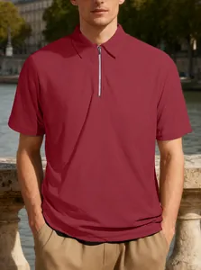 Detail shot of men's burgundy polo shirt with textured jacquard fabric and zipper