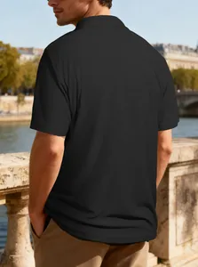Back view of black short sleeve Polo shirt showing detailed jacquard texture and casual fit.