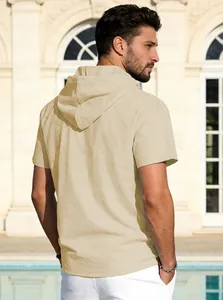 Back view of a casual men's beige cotton linen short sleeve hooded T-shirt by a sunny pool