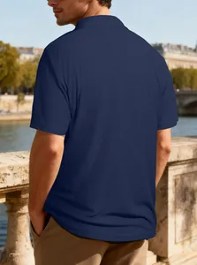 Back view of a navy blue textured jacquard polo shirt for men on city background