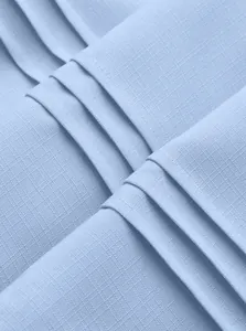 Macro shot of breathable light blue fabric texture on men's casual shirt jacket