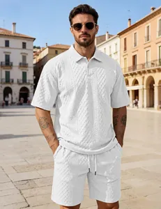 Full look of white textured polo and shorts set on a model against city architecture