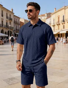 Detailed view of the navy blue textured knit fabric on this men's casual polo set