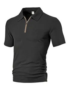 Detail of the zipper placket and textured towel jacquard fabric on a dark grey Polo shirt