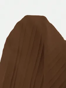 High-resolution detail view of deep brown pleated fabric texture for men's casual suit