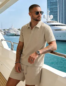 Detailed view of men's beige textured jacquard polo shirt and shorts set on yacht