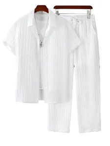 Detailed view of men's casual white pleated two-piece set with shirt and trousers