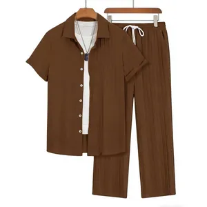 Detailed view of men's brown vertical pleated short sleeve shirt and pants two-piece set