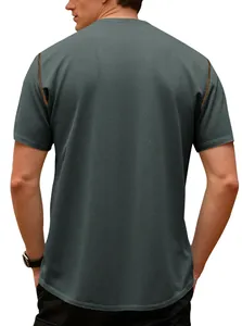 Rear view of men's dark grey polo shirt with textured pineapple grid pattern.