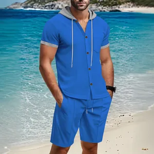 Men's blue casual hooded short-sleeve shirt and shorts set on a summer beach