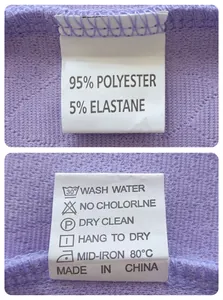Close-up detail of the care and composition label on a lavender textured jacquard T-shirt