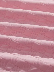 Macro detail of pink jacquard fabric texture for men's breathable loungewear set
