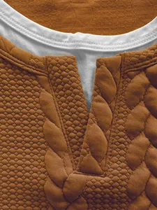 Detailed view of men's textured jacquard T-shirt collar showing the fake two-piece design.