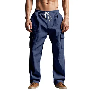 Close-up of men's blue loose linen cargo pants with functional drawstring and cargo pockets