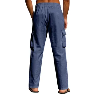 Rear view of men's loose blue linen cargo pants with multi-pockets and elastic waist.