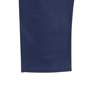 Macro view of navy blue wide-leg trousers hem showcasing clean stitching and texture