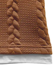 Close-up of brown jacquard fabric and white hem detail on a men's faux two-piece T-shirt