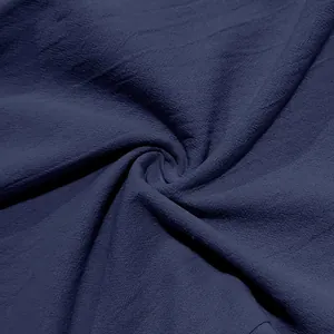Close-up of navy blue breathable linen fabric texture for men's loose casual pants
