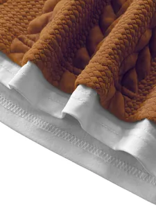 Close-up of textured jacquard fabric and stitching on a men's fake two-piece casual T-shirt.