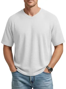 Close-up detail of men's white V-neck waffle knit T-shirt featuring stylish raglan sleeves.