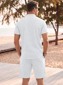 Detailed back view of men's white jacquard short-sleeve loungewear set at the beach
