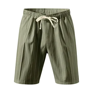 Close-up detail of men's olive green striped casual shorts with drawstring elastic waist
