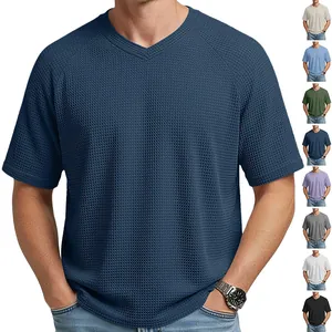 Detail view of men's waffle knit V-neck T-shirt in navy with multi-color swatches