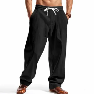 Detailed view of men's loose black wide-leg casual pants with drawstring waist