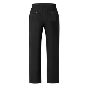 Back view of men's loose black trousers featuring elastic waist and buttoned pockets