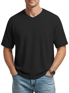 Detailed view of black men's waffle knit T-shirt featuring a V-neck and raglan sleeves