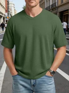 Close-up of men's olive green waffle knit V-neck T-shirt showing raglan sleeve detail