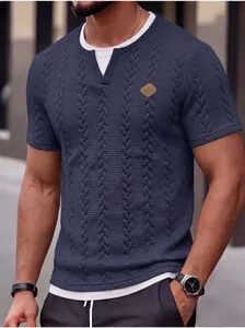Detailed view of men's navy slim fit textured jacquard T-shirt featuring a leather patch logo
