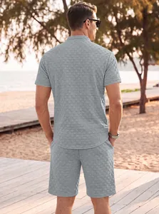 Rear view of men's grey jacquard leisure set showing intricate fabric texture