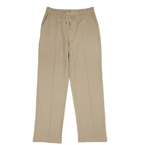 Front view detail showing the full length and drawstring waist of men's khaki linen pants