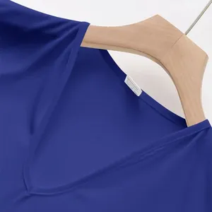 Close-up of a blue men's V-neck breathable sports vest with wash tag detail