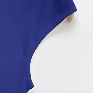 Detailed macro view showing precise stitching on the armhole of a blue men's tank top