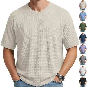 Detail showing texture and multiple colors of men's V-neck waffle knit T-shirt