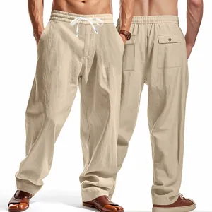Detail of men's loose breathable wide-leg trousers in beige with drawstring waist.