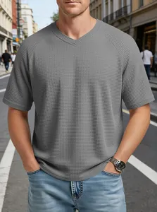 Close-up of men's grey V-neck T-shirt with waffle knit texture and raglan sleeves