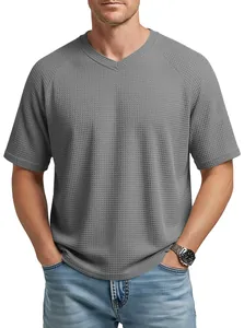 Detailed view of the grey waffle knit texture and V-neckline on this casual men's raglan T-shirt