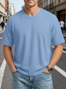 Close-up of men's blue V-neck waffle knit T-shirt with raglan sleeves