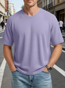 Close-up of a stylish men's purple waffle knit V-neck T-shirt with raglan sleeves