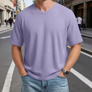 Men's lavender V-neck waffle knit t-shirt with raglan sleeves in a casual street style.