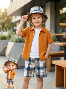 Stylish boy's summer outfit featuring a plaid shirt, shorts, and a matching bucket hat