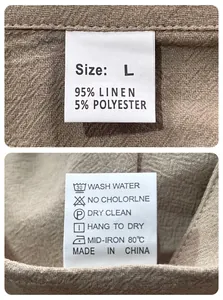 Macro detail of the interior care label on a men's breathable linen-blend casual shirt.