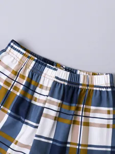 Macro view of boys' plaid shorts featuring a flexible and comfortable elastic waistband