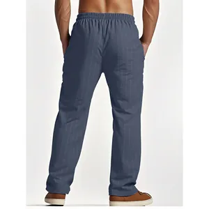 Detailed back view of men's blue pinstriped linen beach pants with straight leg design