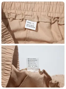 Detailed view of wash care label and size tag for men's beige linen casual pants